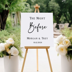 Puede incluir: Un cartel blanco con texto negro en un caballete. El cartel dice "The Night Before Morgan & Trey 01.12.2024".
