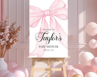 Letrero de bienvenida para baby shower con lazo rosa para niña. Disponible en lienzo, acrílico o cartulina.
