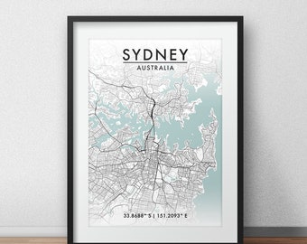 May include: A black and white map of Sydney, Australia, with a light blue background. The map shows the city's streets and waterways. The text "SYDNEY" and "AUSTRALIA" is printed at the top of the map. The coordinates "33.8688° S | 151.2093° E" are printed at the bottom of the map.