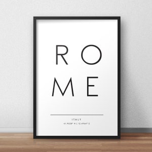 May include: Black and white typography print with the word "ROME" in large letters and the text "ITALY" and coordinates "41.9028&deg; N | 12.4964&deg; E" in smaller letters below.