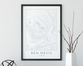 May include: A black framed print with a topographic map of Ben Nevis, a mountain in Scotland. The map is in shades of blue and white. The text "Ben Nevis 1,345 M" is printed at the bottom of the map.