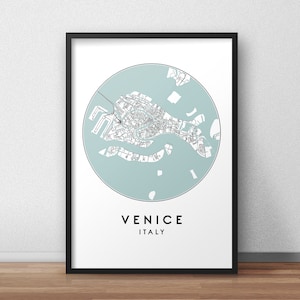 May include: A black and white map of Venice, Italy, in a circle on a white background. The map is in a light blue circle with the word "VENICE" and "ITALY" below the circle.