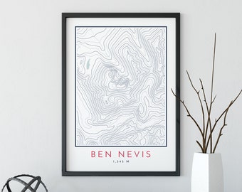 May include: A black framed print with a topographic map of Ben Nevis, a mountain in Scotland. The map is in shades of blue and white. The text "BEN NEVIS 1,345 M" is printed in red at the bottom of the print.