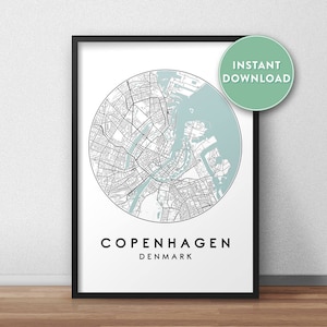 May include: A printable map of Copenhagen, Denmark, in a black frame. The map is a circle with a light blue background and black lines showing the streets. The text "Copenhagen, Denmark" is printed below the map.