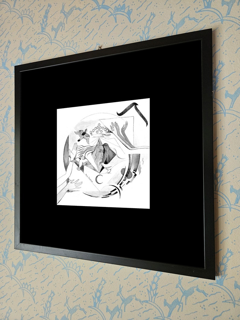 May include: Black and white drawing of a woman with her arms outstretched, surrounded by abstract shapes and a crescent moon. The drawing is framed in a black frame.