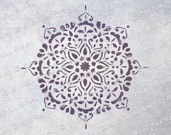 May include: A black and white mandala stencil with intricate details. The stencil is designed for use with paint or other mediums to create a decorative pattern.