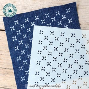 May include: A blue denim fabric sample with a white cross pattern is shown next to a stencil with the same design. The stencil is white with black cross cutouts. The image includes the text "Image Copyright Stencil Stash".