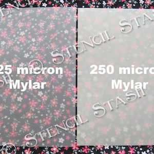May include: Two sheets of clear Mylar, one 125 micron and one 250 micron, on a floral patterned background.