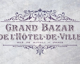 May include: A vintage-style stencil with the text "Grand Bazar de l'Hotel-de-Ville Rue de Rivoli Paris". The stencil features a decorative border with ornate scrollwork.