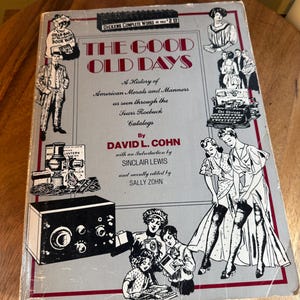 May include: Vintage book cover titled "The Good Old Days" with illustrations of people, a radio, and other vintage items. The book is a history of American morals and manners as seen through Sears Roebuck catalogs.