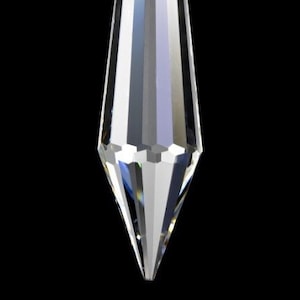May include: A clear crystal teardrop prism with a faceted design. The prism has a hole at the top for hanging.