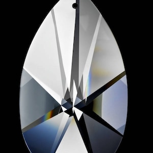 May include: A clear crystal teardrop pendant with a faceted design. The pendant has a hole at the top for hanging.