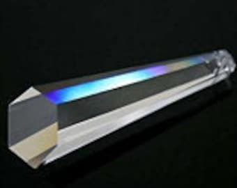 May include: A clear glass prism with a hexagonal base and a pointed tip. The prism is about 10 inches long and has a rainbow effect when light shines through it.