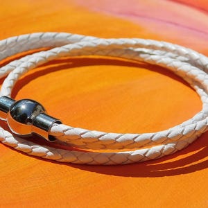 Ladies / Womens White leather multi-strand, wraparound bracelet with a stainless steel magnetic clasp by Lyme Bay Art.