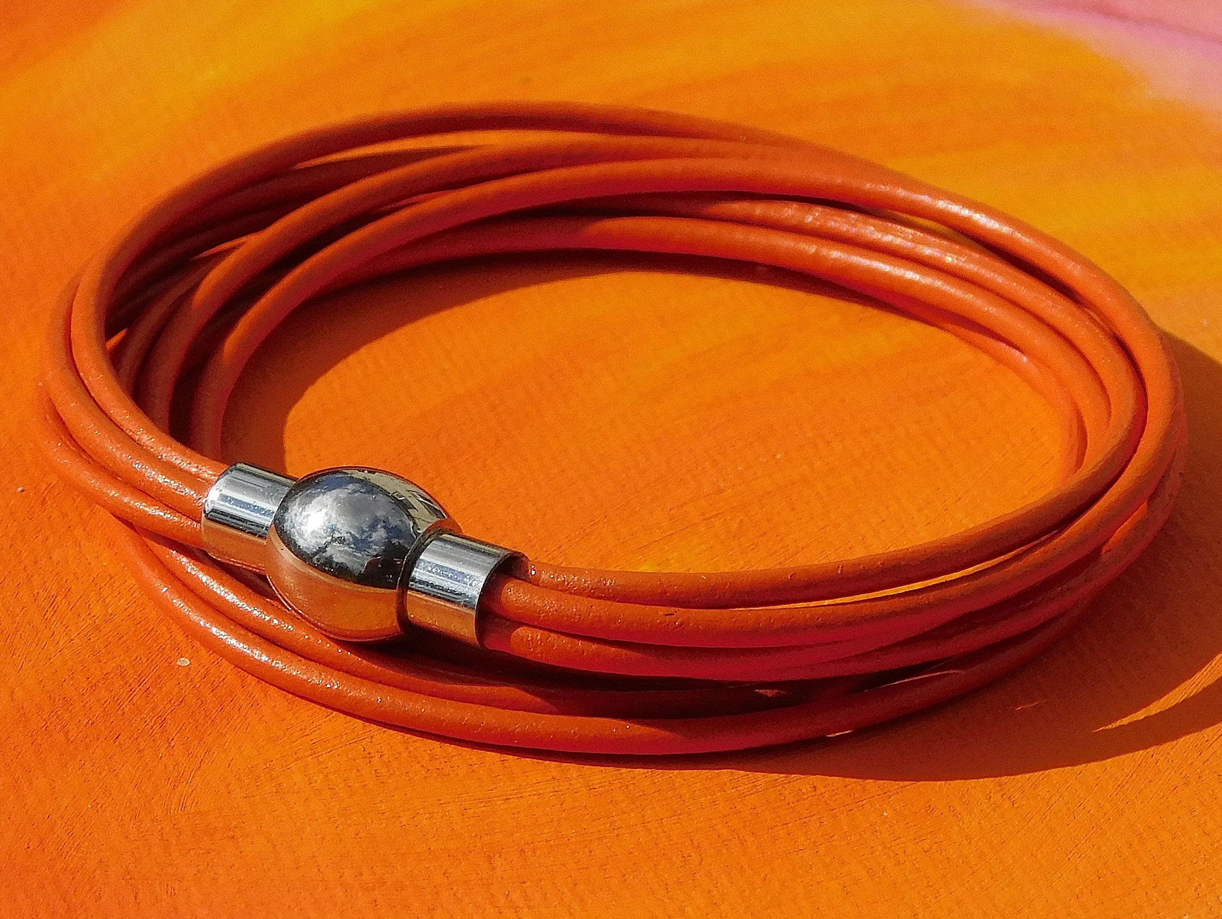 Orange leather bracelet deals