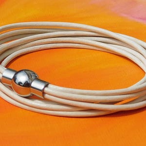 Ladies / Womens White leather multi-strand, wraparound bracelet with a stainless steel magnetic clasp by Lyme Bay Art.