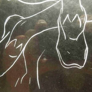 May include: A minimalist line drawing in white on a dark background. The artwork depicts a stylized figure, possibly a person or animal, with simple lines defining the form. The style is reminiscent of a sketch.