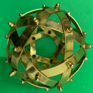Genesa Pentasphere 10 cm diameter on brass, bands 10 mm wide and fixed with brass blind nuts