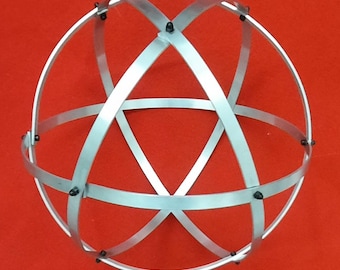 Genesa Crystal in Polished Natural Aluminium, 25 cm diameter with 10 mm wide bands, symmetrical braided black blind nuts fixed