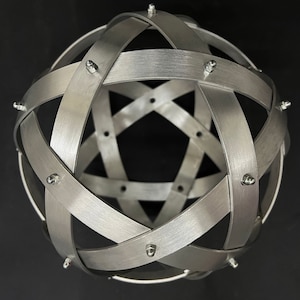 Genesa Pentasphere in Natural Brushed Aluminum 25 cm in diameter with 20 mm wide bands, symmetrical weaves and aluminum rivets