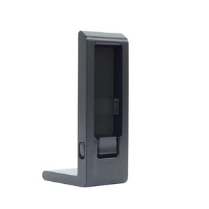 May include: A black, L-shaped bracket with a rectangular opening and a small, circular hole. The bracket is made of a smooth, matte material and is designed to hold an item. The design is simple and modern.
