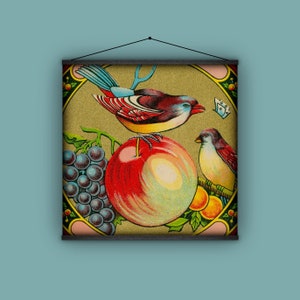 May include: A vintage illustration of a red apple, grapes, and two birds. The apple is surrounded by grapes and the birds are perched on branches. The background is a gold color.