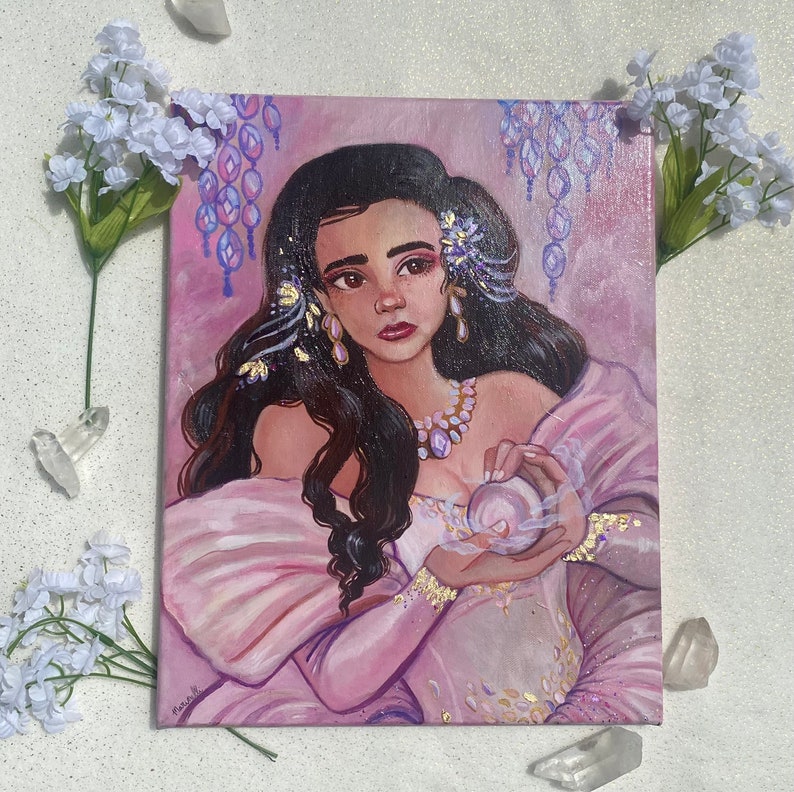 May include: A painting of a woman with long dark hair wearing a pink dress and holding a pearl in her hands. She is surrounded by purple and white flowers and has a delicate gold necklace on.