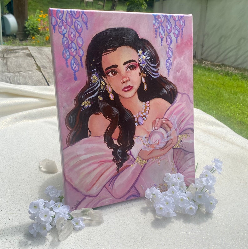 May include: A painting of a woman with long dark hair wearing a pink dress and holding a pearl. She is surrounded by a purple and pink background with a floral design.