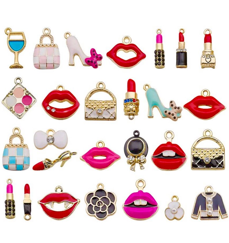 May include: A set of 24 gold-toned charms featuring various fashion and beauty-themed designs. The charms include lips, purses, shoes, lipstick, and a wine glass. The charms are perfect for adding a touch of glamour to jewelry, keychains, or other crafts.