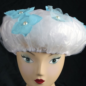 Our Designer Shower Caps will keep your locks dry, this is our petals & pearls in light blue design, your favorite  bathtime accessory.