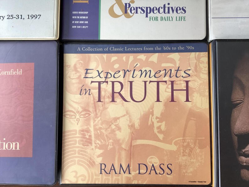May include: A book cover with a yellow, orange, and brown background. The title is "Experiments in TRUTH" by Ram Dass. A collection of classic lectures from the 60s to the 90s.