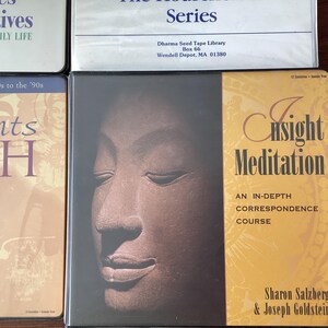 May include: A book cover with a brown and gold design. The title is "Insight Meditation: An In-Depth Correspondence Course" by Sharon Salzberg & Joseph Goldstein. The Dharma Seed Tape Library logo is in the top left corner.
