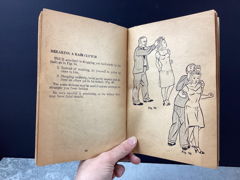 May include: Open book page with illustrations and text about self-defense techniques. The text reads "BREAKING A HAIR CLUTCH" with instructions and diagrams. Figures 95 and 96 show step-by-step actions.