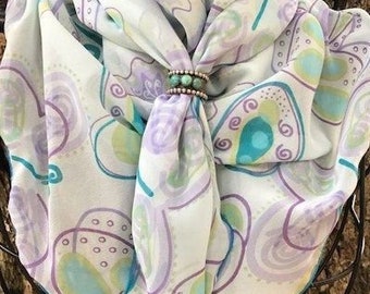 Chiffon wild rag scarf with butterfly print in shades of lavender, purple, turquoise, green and yellow.