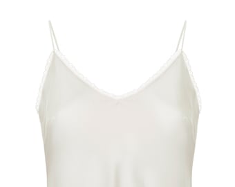 May include: Cream-coloured camisole featuring thin spaghetti straps and a V-neck. The neckline is trimmed with a delicate lace. This silky top is a versatile wardrobe staple.