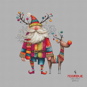 May include: A colorful cross stitch pattern featuring a whimsical Santa Claus with a long white beard and a reindeer with a red nose. The Santa Claus is wearing a red, yellow, and blue patterned jacket and a colorful scarf. The reindeer is wearing a colorful patterned scarf. The pattern is titled "FEERIQUE cross stitch patterns".