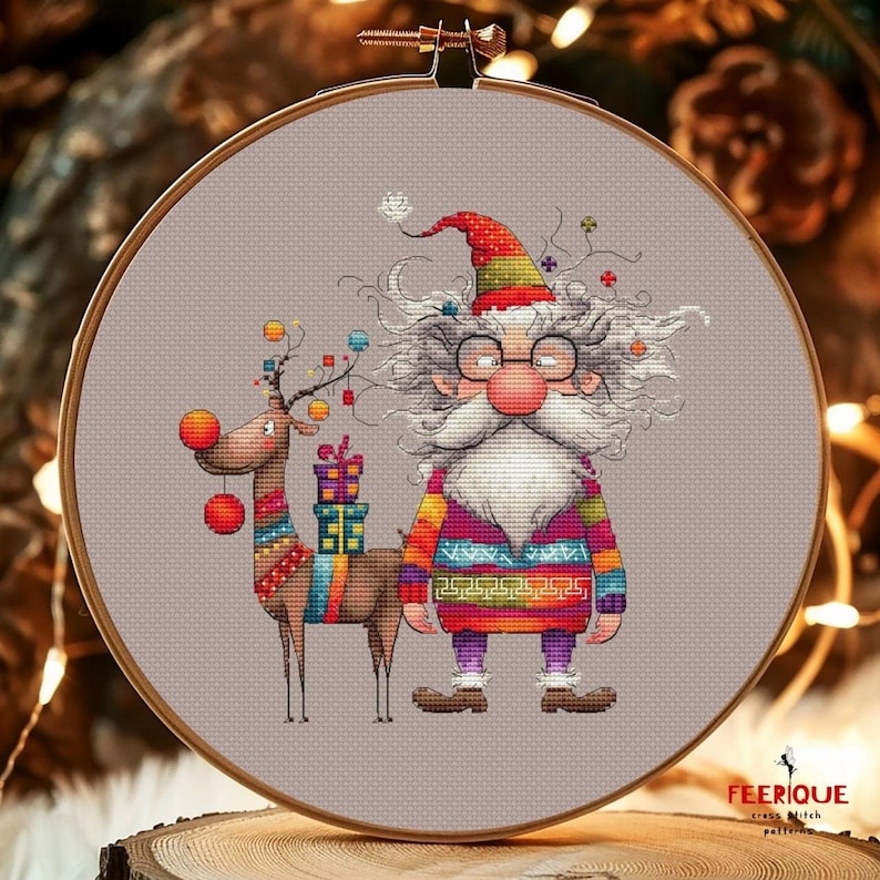 May include: A cross stitch pattern featuring a whimsical Santa Claus with a long white beard and glasses, wearing a colorful sweater and holding a gift. A reindeer with red ornaments and a gift is standing next to him.