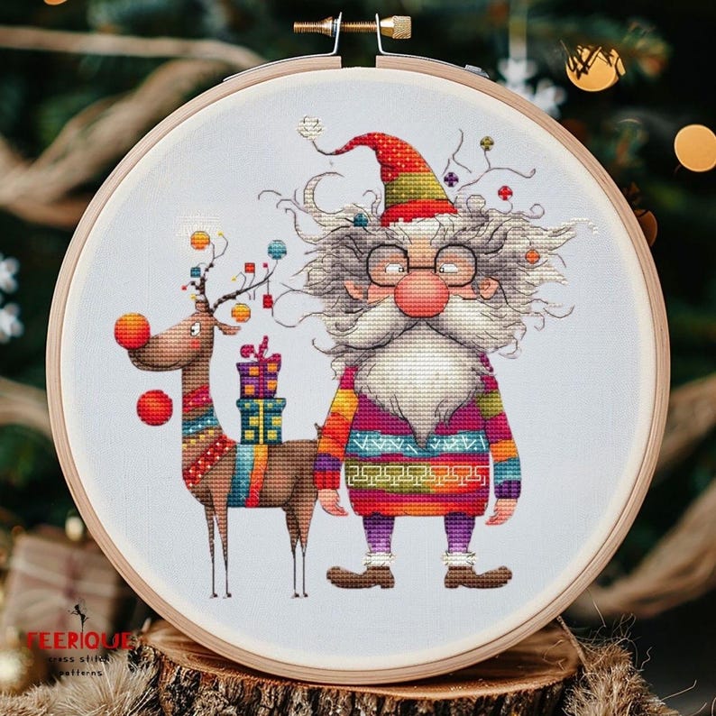 May include: A cross-stitch pattern featuring a whimsical Santa Claus with a long white beard and a reindeer carrying presents. The Santa Claus is wearing a colorful sweater and glasses. The reindeer is wearing a colorful patterned scarf. The background is a light blue.