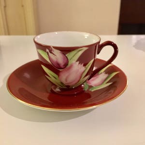 Vintage Collector Cup and Saucer Marked Made In occupied Japan  Beautiful rich burgundy color with accent flower