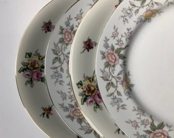 Mismatched China Dinner Plates with a floral theme. 1117