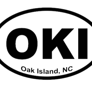 May include: Black and white oval sticker with the text "OKI" and "Oak Island, NC".