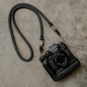 Black Camera neck strap with optech qd mini loop attachments