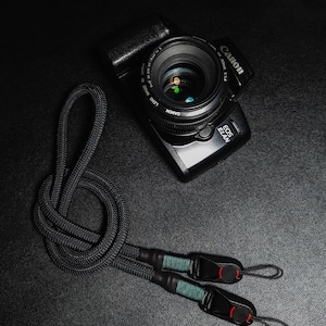 Black Camera neck strap with quick release attachments