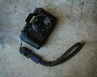 Black rope camera wrist strap w/ quick release connector