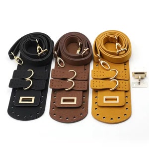 May include: Three leather bag straps in black, brown, and mustard yellow. Each strap has gold-coloured hardware, including clasps and buckles. The straps are designed with multiple holes for adjustable length and feature a rectangular base.