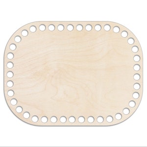 May include: A round wooden base with holes around the edge for crocheting. The base is light brown and has a smooth surface.