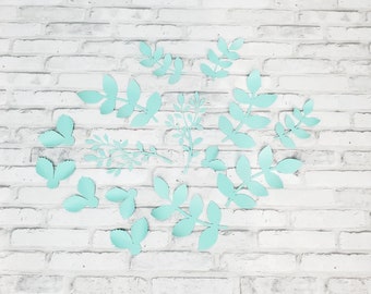 Fourteen paper leaves wall decor nursery in light pastel green. Nursery paper leaves wall decor. Branches of leaves for wall decor.