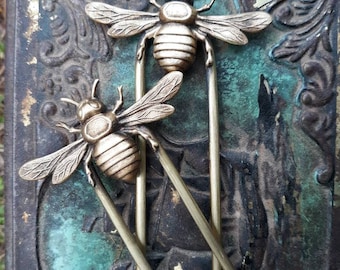 One 5" brass honey bee hair fork