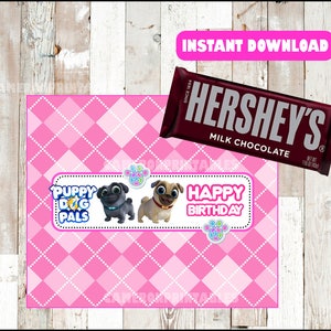 May include: Printable favor bag design featuring a pink and white checkered pattern with a banner that says "Puppy Dog Pals" and "Happy Birthday". The banner has two cartoon pugs on it. The design is meant to be printed on a Hershey's chocolate bar wrapper.