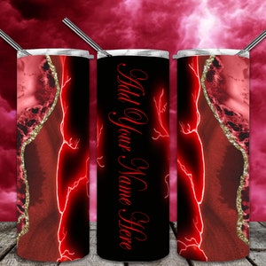 May include: Three stainless steel tumblers with red and gold agate designs and red lightning bolts. The middle tumbler has the text "Add Your Name Here" in red.